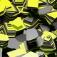 Dynamic abstract image of layered yellow and gray shapes creating a vivid geometric pattern.